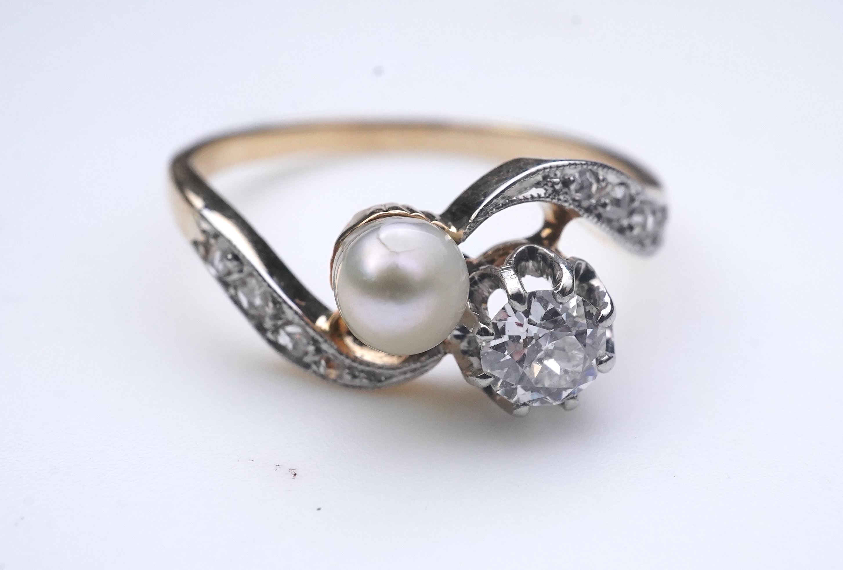 A pearl and diamond toi-et-moi ring, early 20th century